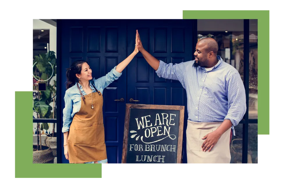 Franchise Owners Opening Shop and High Fiveing each other